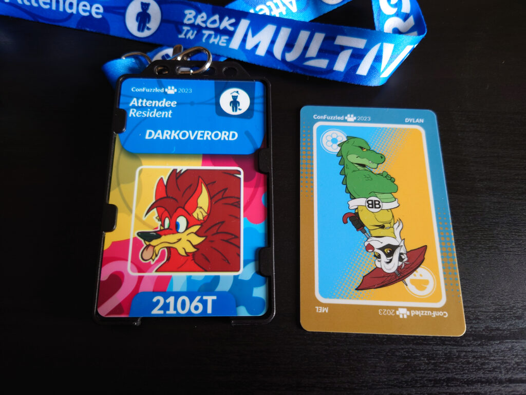 A photo of DarkOverord's Confuzzled registration badge and room keycard
