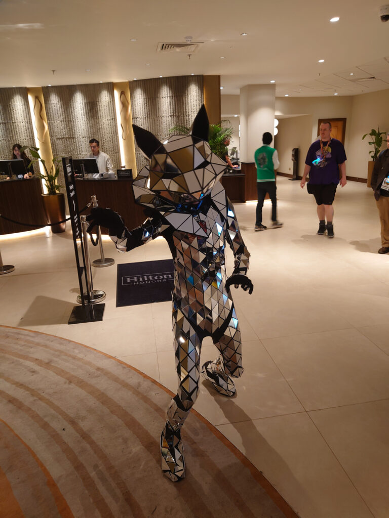 A photo of a canid or vulpine suiter, who instead of fur was made up completely of multiple mirrors tiled across the entire body