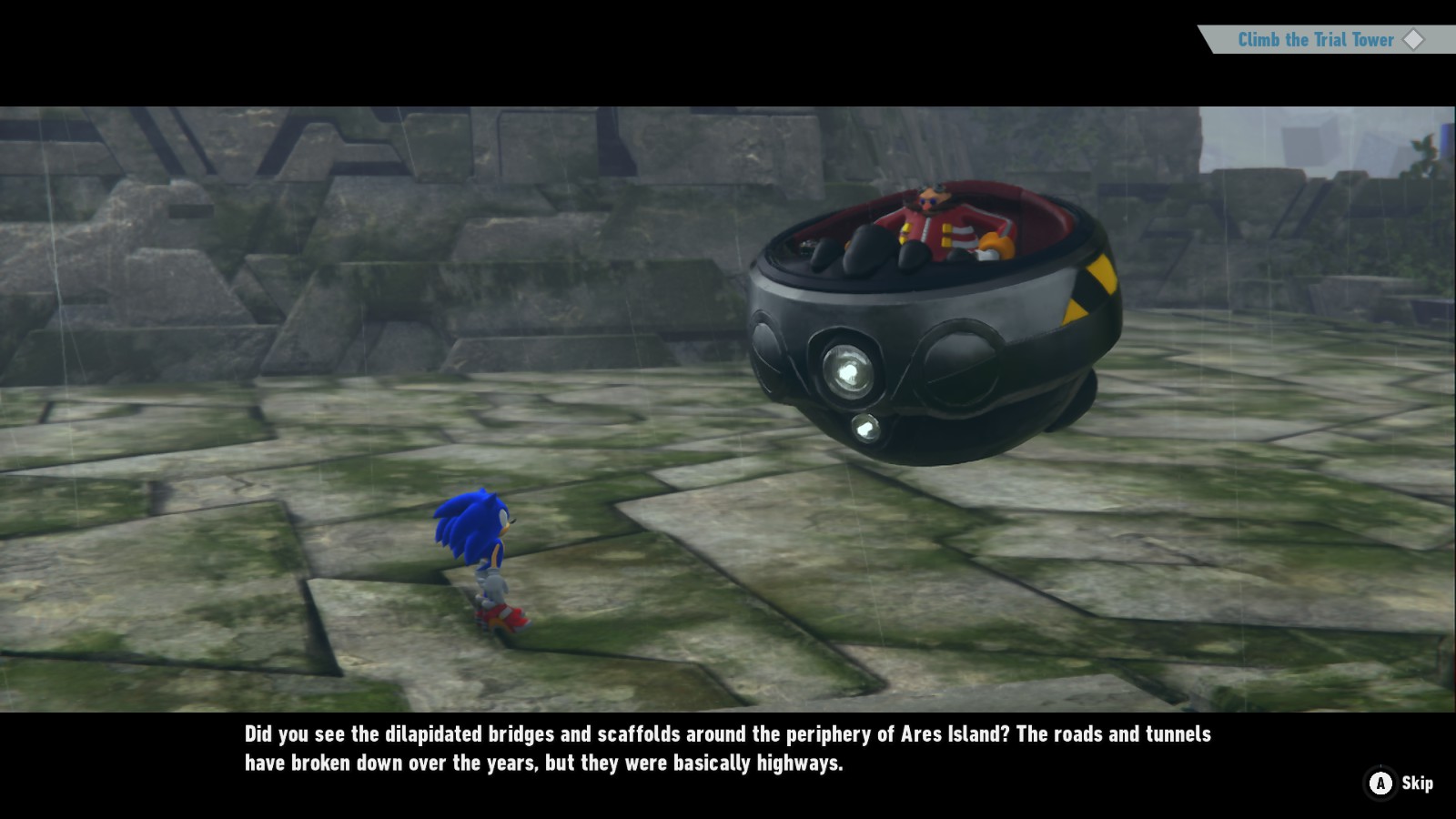 A screenshot of Sonic Frontiers. Eggman in his Eggmobile is talking to Sonic while in some ruins. The subtitle below reads: "Did you see the dilapidated bridges and scaffolds around the periphery of Ares Island? The roads and tunnels have broken down over the years, but they were basically highways"