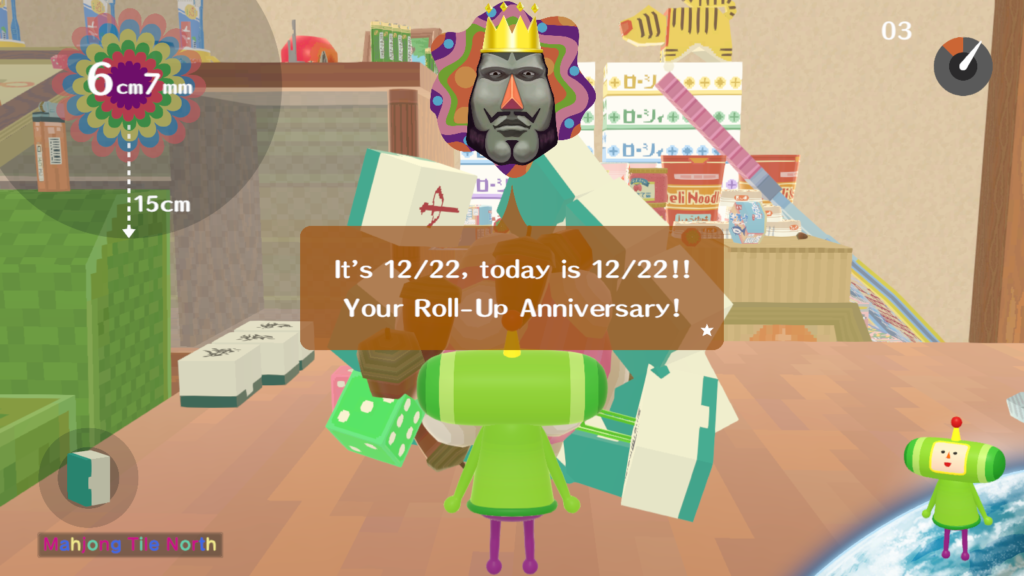 A screenshot of Logo for We Love Katamari REROLL+ Royal Reverie. The King of All Cosmos looks surprised as he announces that the 22d of December is my Roll-Up Anniversary