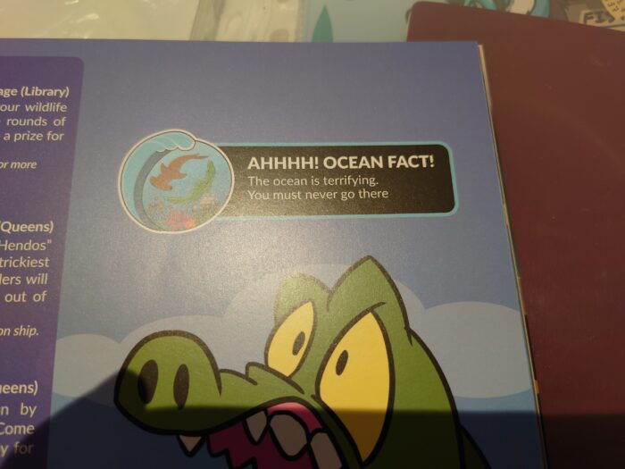 A photo of Confuzzled 2024's conbook of a "fact" that says: "AHHHH! OCEAN FACT! The ocean is terrifying. You must never go there". Art of Dylan looking scared is just visible underneath it