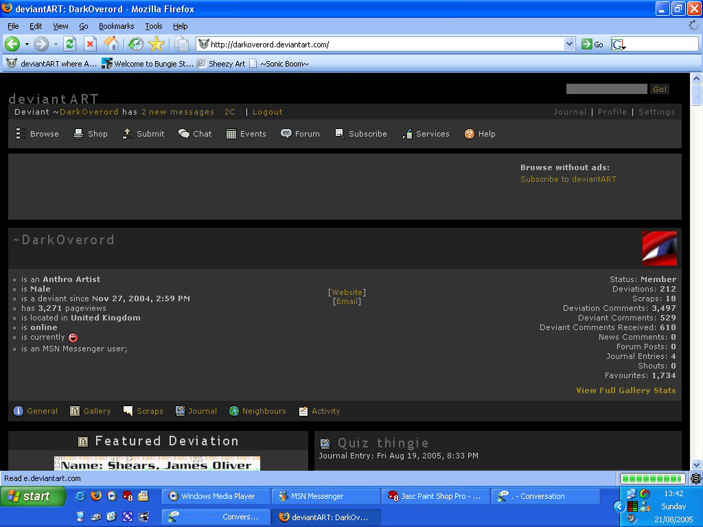 A full screen screenshot of a Windows XP era Firefox. The webpage loaded is DarkOverord's page on deviantART, though using a custom script to skin it in dark colours. There's multiple key bits of information such as being "an Anthro Artist" and "deviant since Nov 27, 2004, 02:59PM" The XP task bar has multiple icons in quick launch such as Internet Explorer and Firefox, and a couple other windows are Windows Media Player, MSN Messenger, Jasc Paint Shop Pro and Firefox